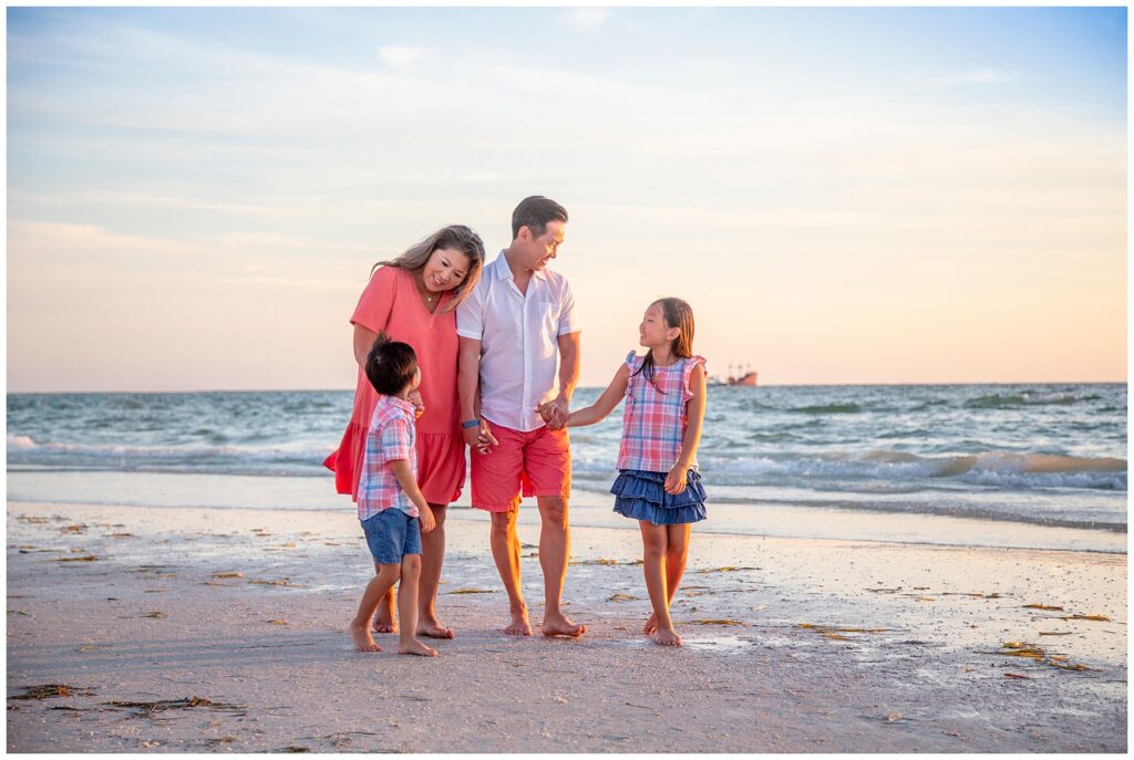 family walking down the beach