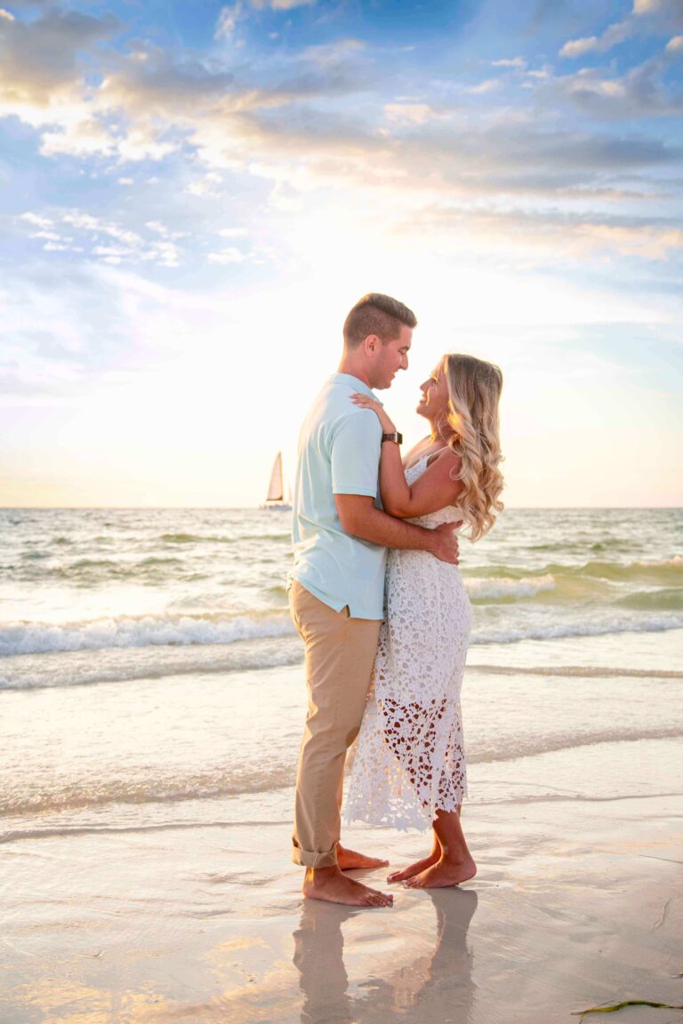 couple embrace on beach- tampa florida photographer