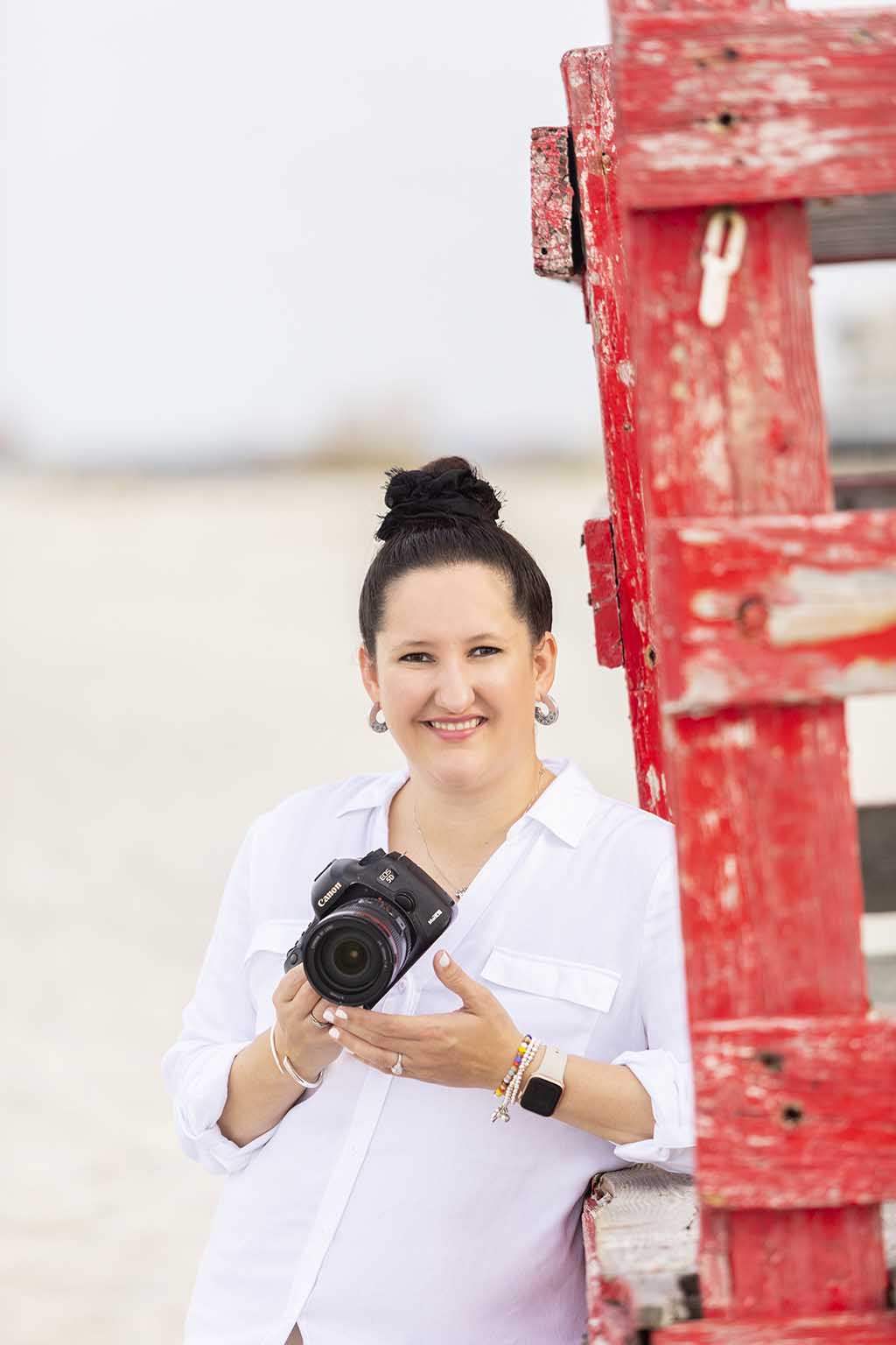 family photographer with camera on beach- tampa family photographer