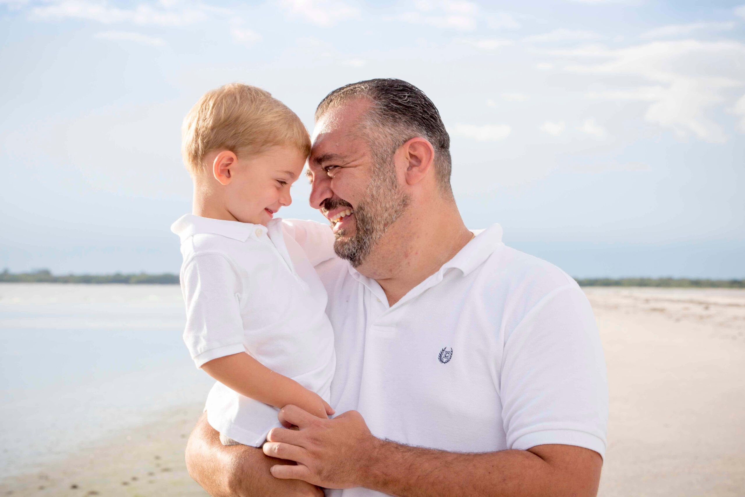 father and son smiling at each other- tampa family photographer