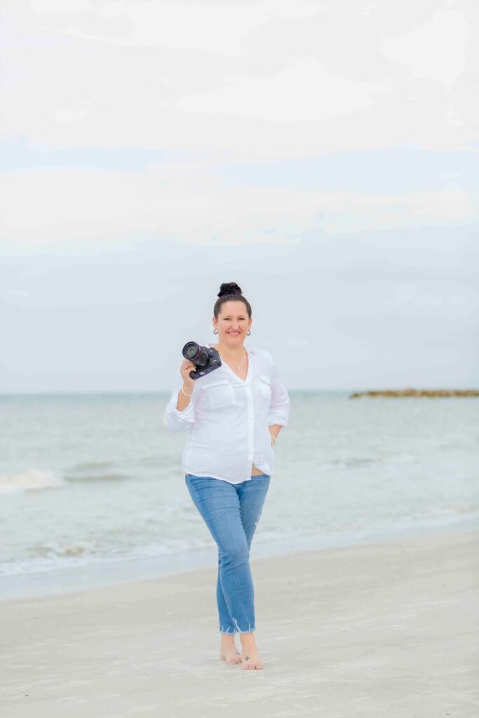 tampa florida photographer on beach holding camera