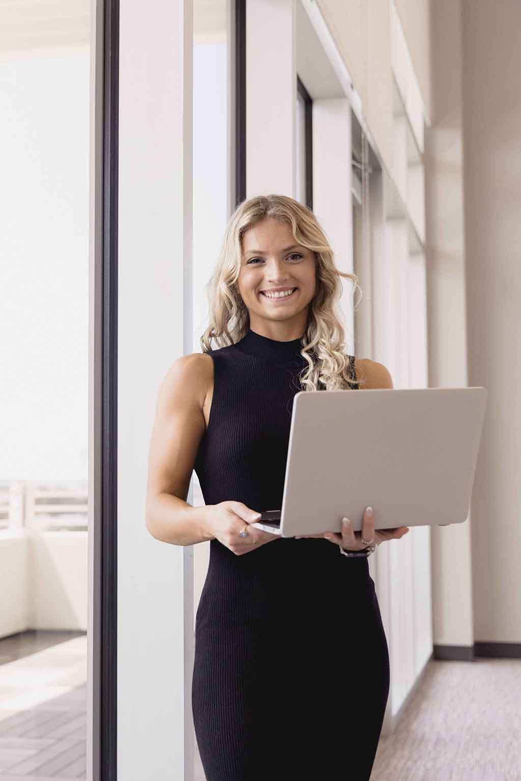 tampa headshot photographer of woman holding laptop