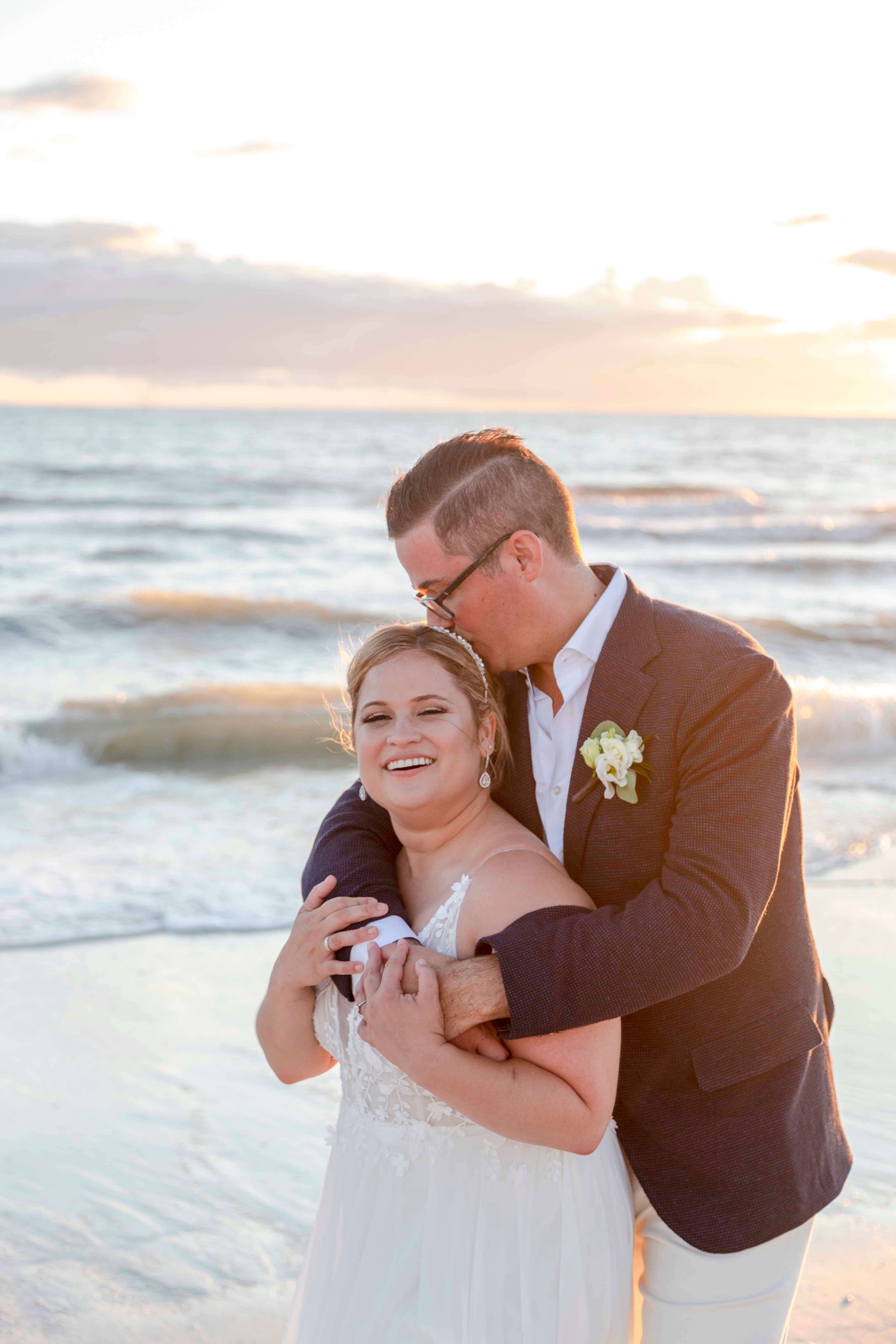 husband and wife just married on beach- wedding photographer tampa fl