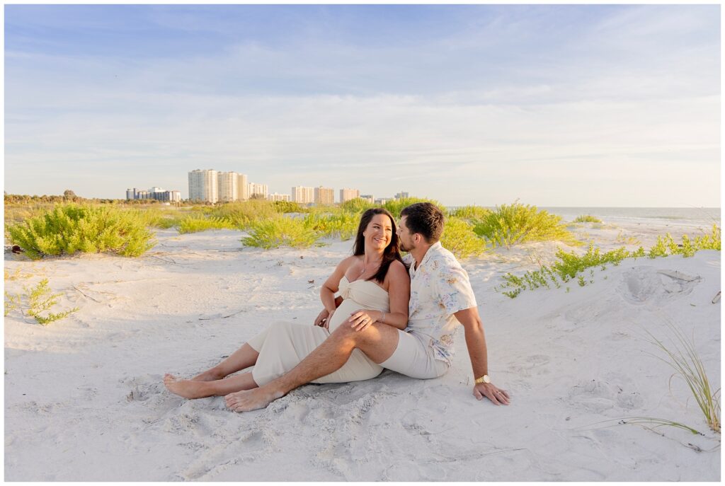 couple at sand key park for maternity pictures