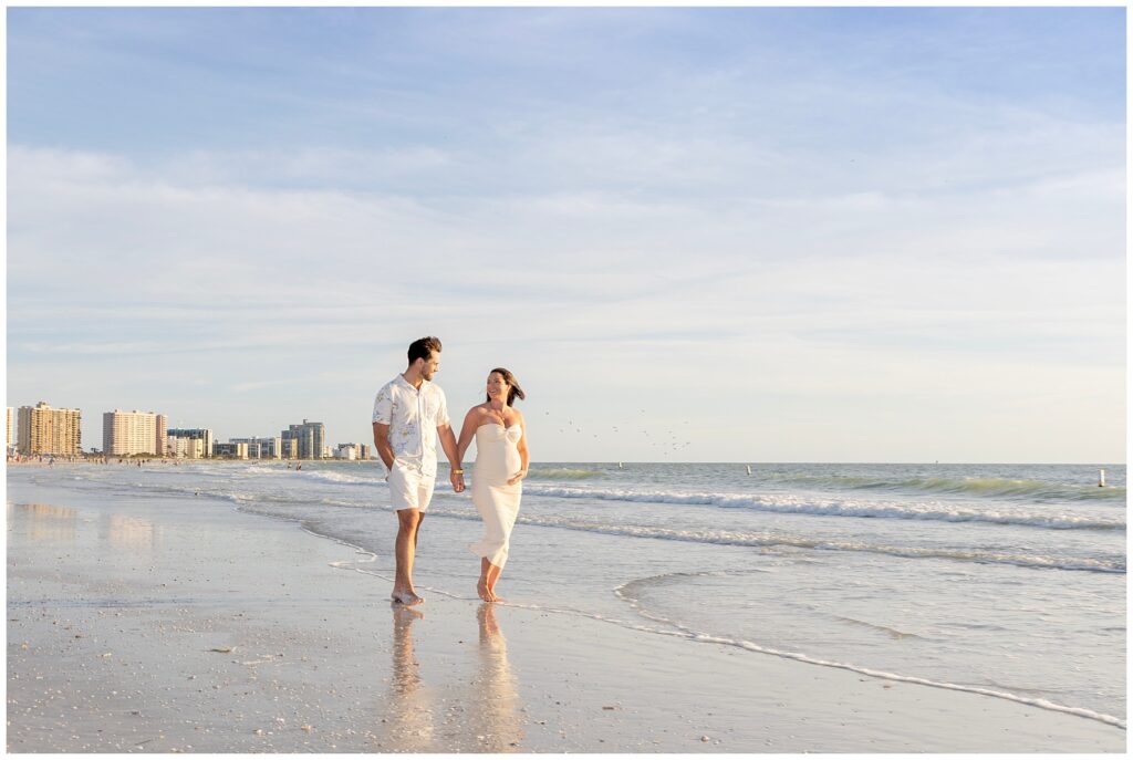 expecting couple embrace for maternity portraits