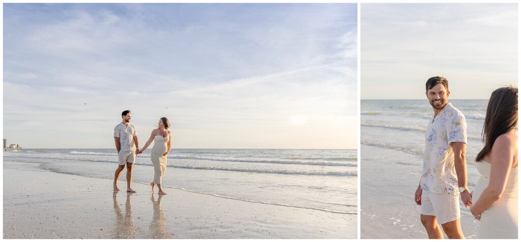 expecting couple holding hands down beach